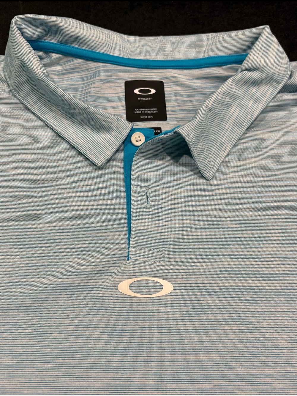 Oakley Men’s Light Blue Heathered Polo with Teal Placket